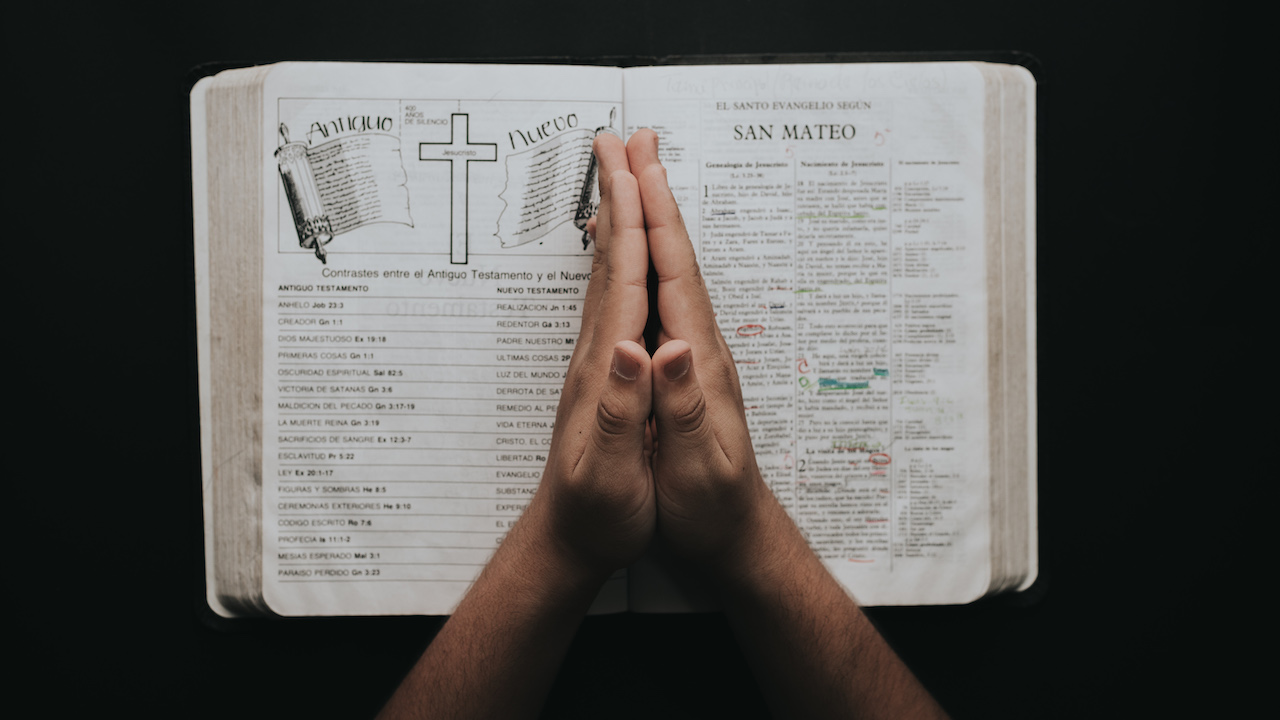 Praying Hands with Bible