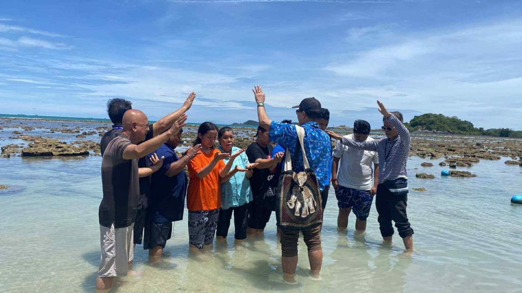 Water baptism of six new believers from Don Muang Church.