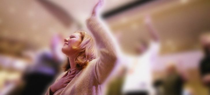 Woman worshipping in church